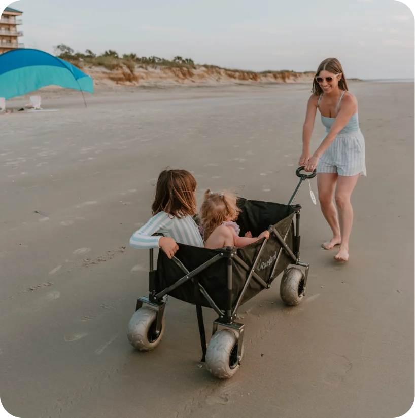 mother pushing daughters in cart