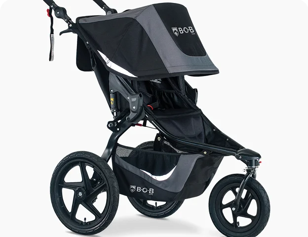 a black and grey stroller with a black cover
